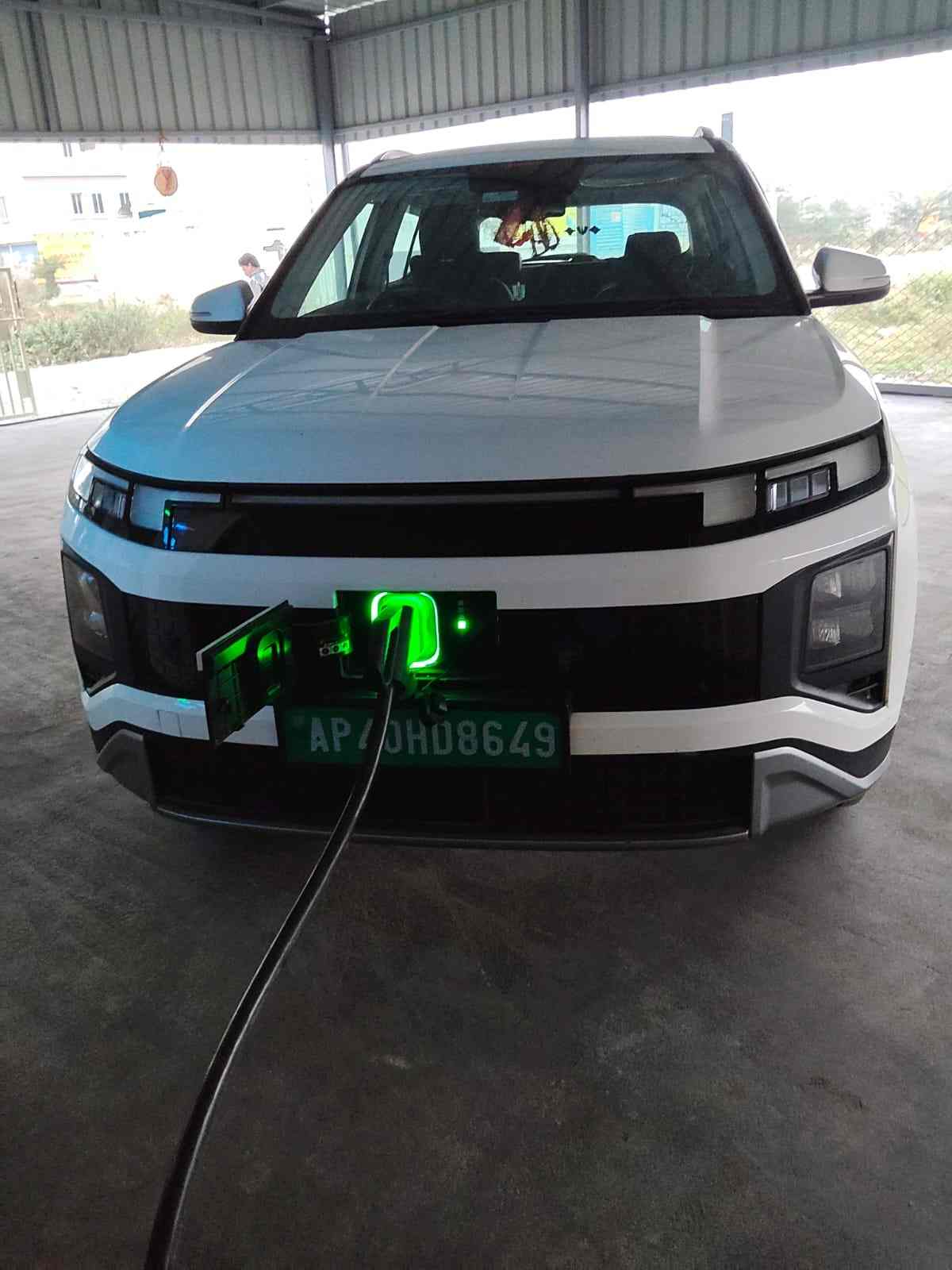 Electric vehicle plugged in for fast charging